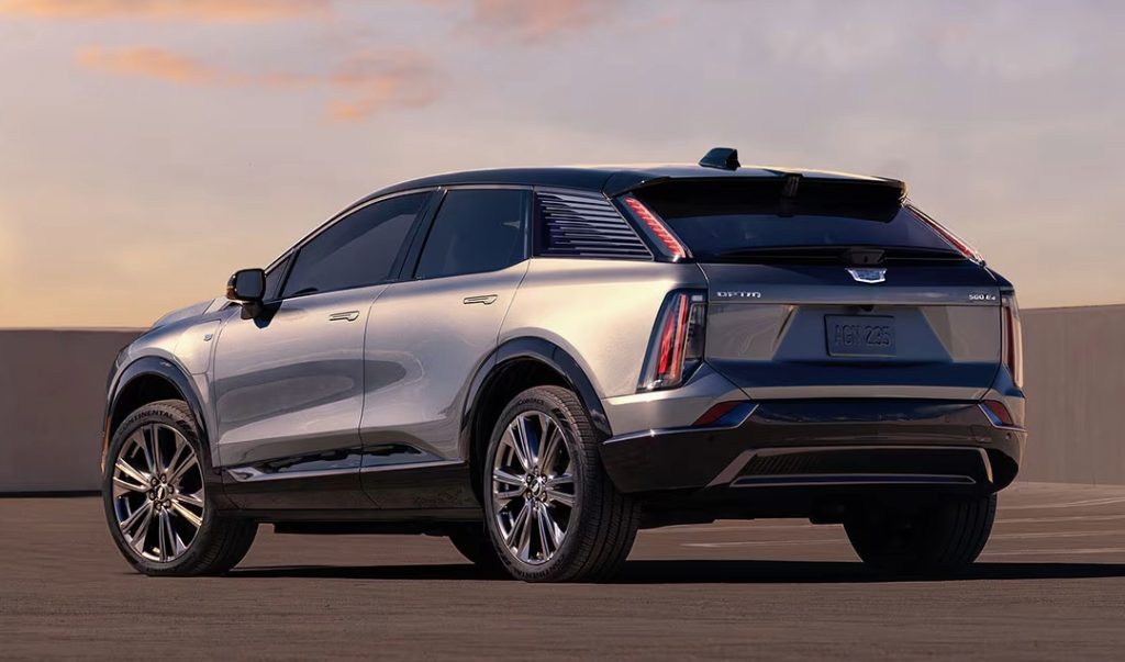 2025 Cadillac Optiq IQ exterior from the rear at sunset