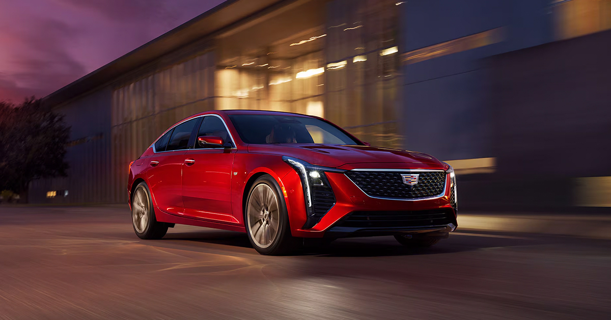2025 Cadillac CT5 in Radiant Red driving at night